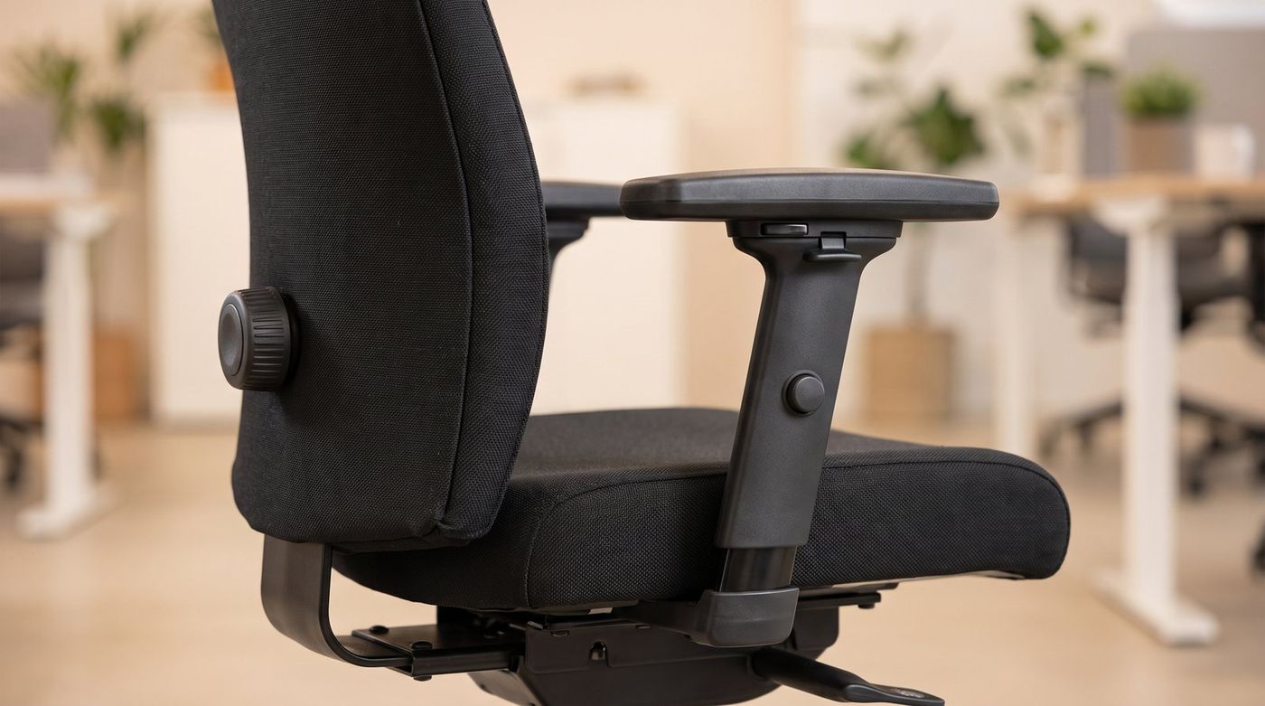 Close-up of a Steelcase Leap V2 lumbar and armrest adjustment controls